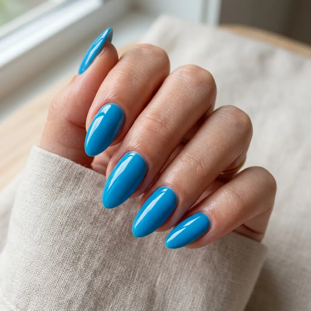 23 Blue Ocean Nails Ideas That Bring Coastal Vibes to Your Manicure 22 Bright Ocean Blue Nails