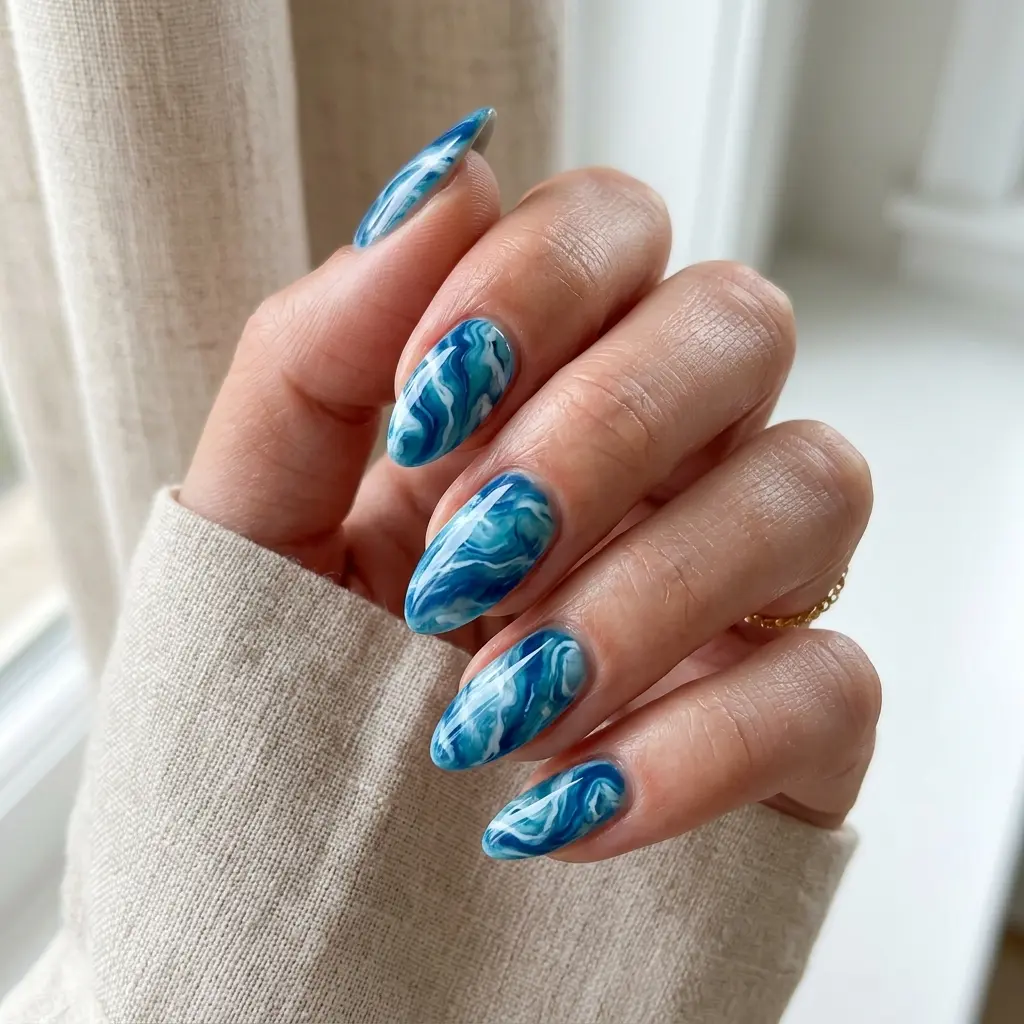 23 Blue Ocean Nails Ideas That Bring Coastal Vibes to Your Manicure 5 Blue Marble Ocean Nails