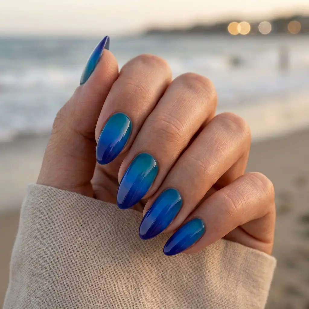 23 Blue Ocean Nails Ideas That Bring Coastal Vibes to Your Manicure 24 Ocean Sunset Blue Nails