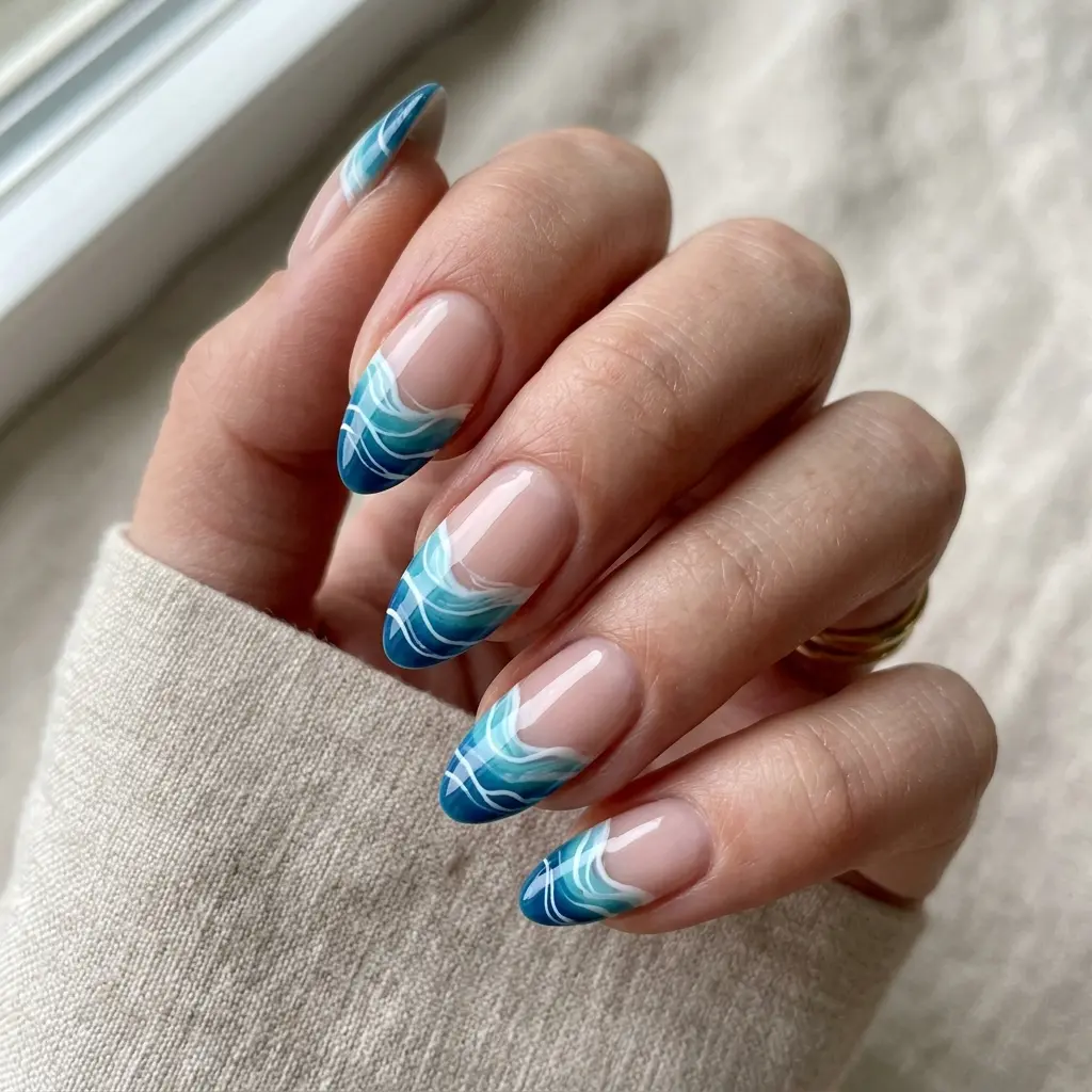 23 Blue Ocean Nails Ideas That Bring Coastal Vibes to Your Manicure 19 Rolling Wave French Tips